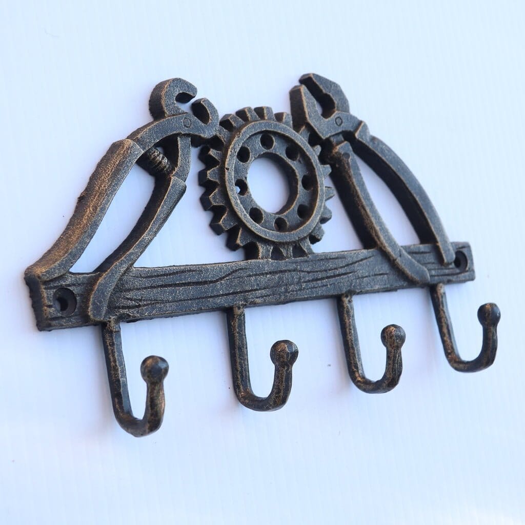 https://www.rusticdeco.com/cdn/shop/products/blacksmith-tools-wall-hanger-farrier-metalwork-cast-iron-hooks-bookends-rustic-deco-883809_2048x.jpg?v=1696413502