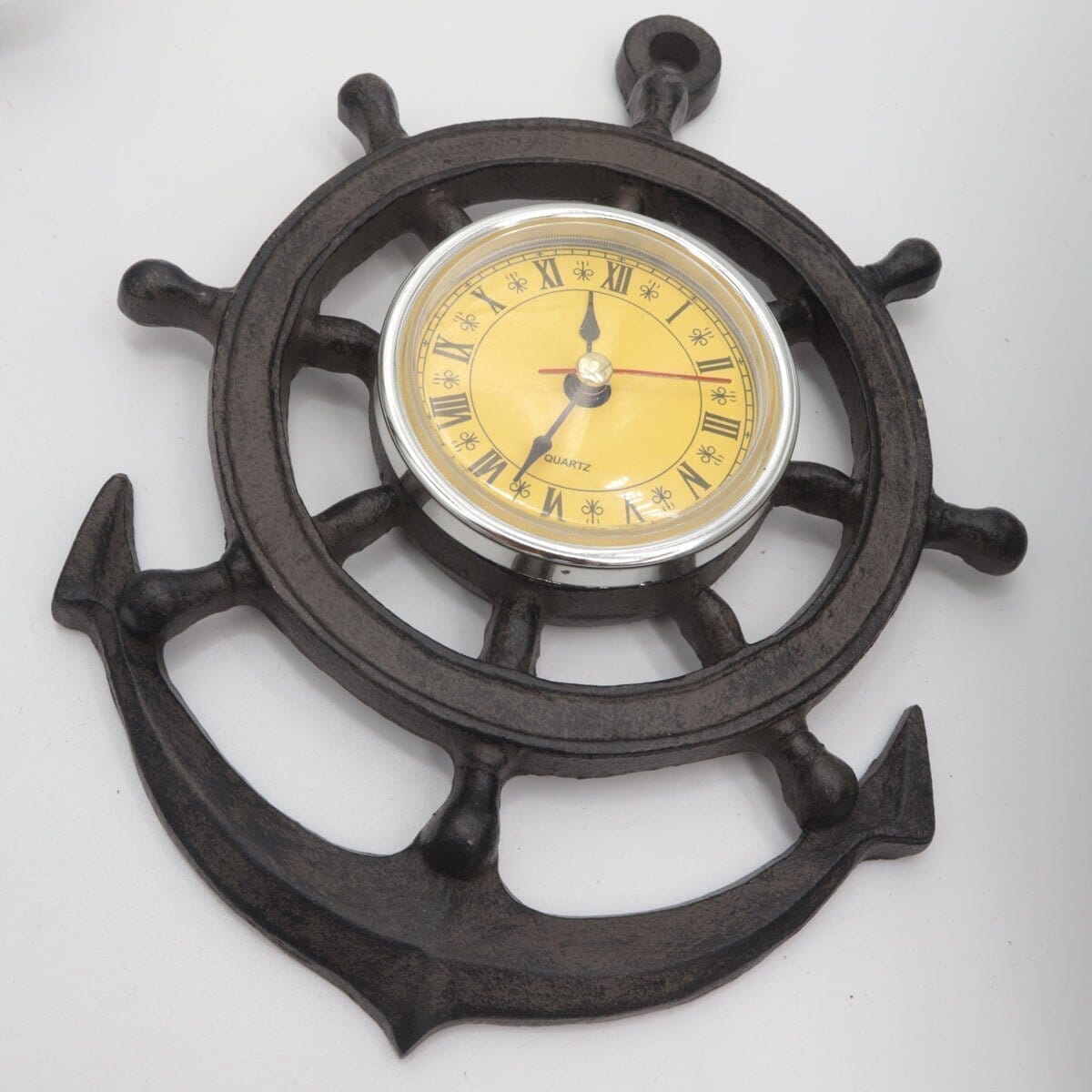 https://www.rusticdeco.com/cdn/shop/products/ship-wheel-design-wall-clock-cast-iron-nautical-clock-rustic-deco-538925_2048x.jpg?v=1694077208